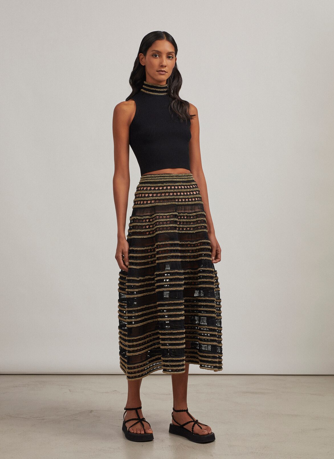 Sleeveless knit and lurex sweater ALAÏA BLACK/GOLD SLEEVELESS KNIT AND LUREX SWEATER